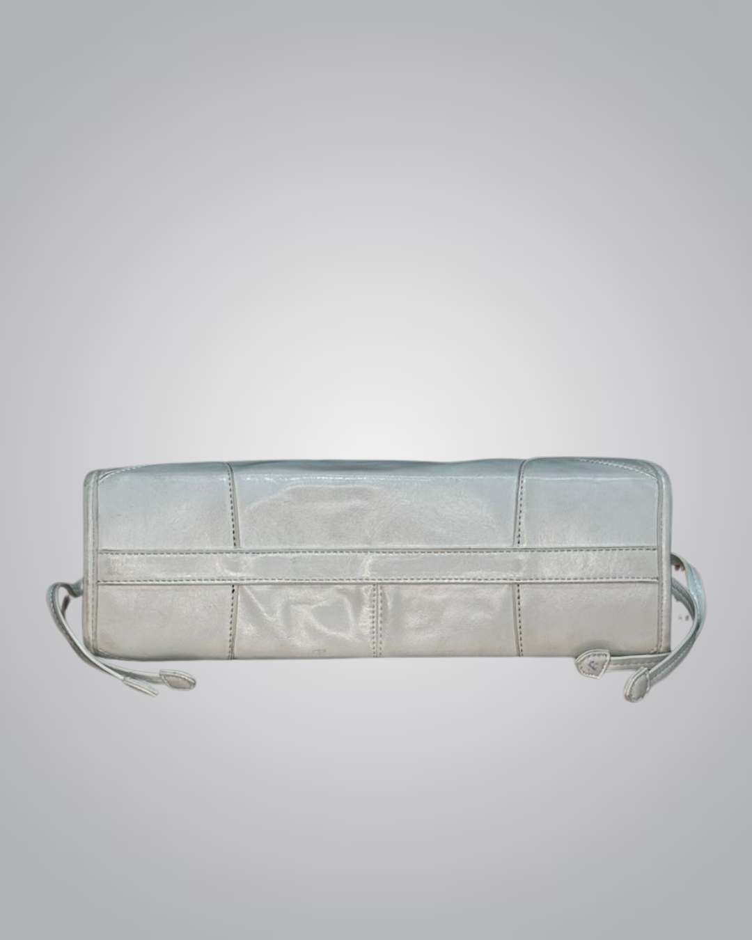 Light blue quilted handbag on a light gray background