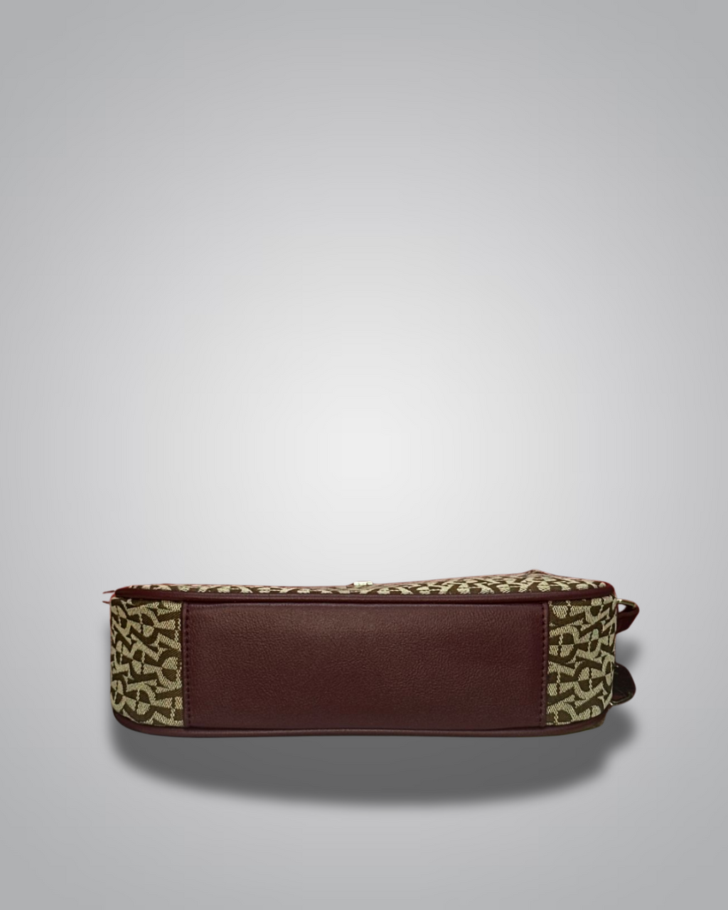 Handbag with monogram pattern on a gray background- Valentino Impex