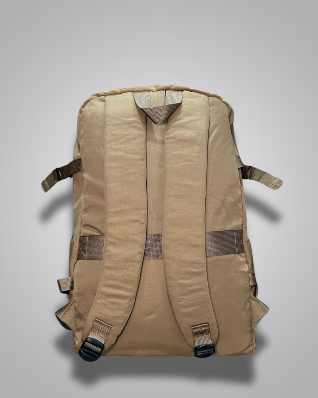 Brown backpack with a visible brand tag on a gray background- Valentino Impex