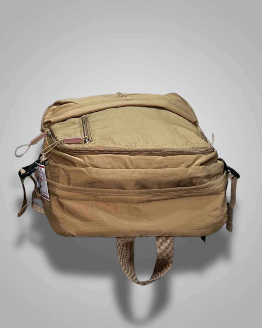 Brown backpack with a visible brand tag on a gray background- Valentino Impex