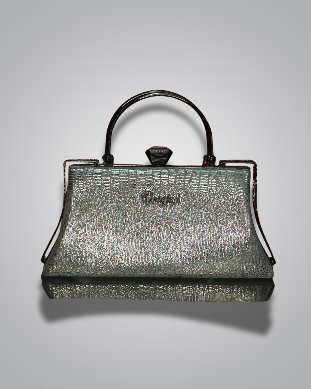 Vintage handbag with metallic sheen on a gray background- Valentino Impex