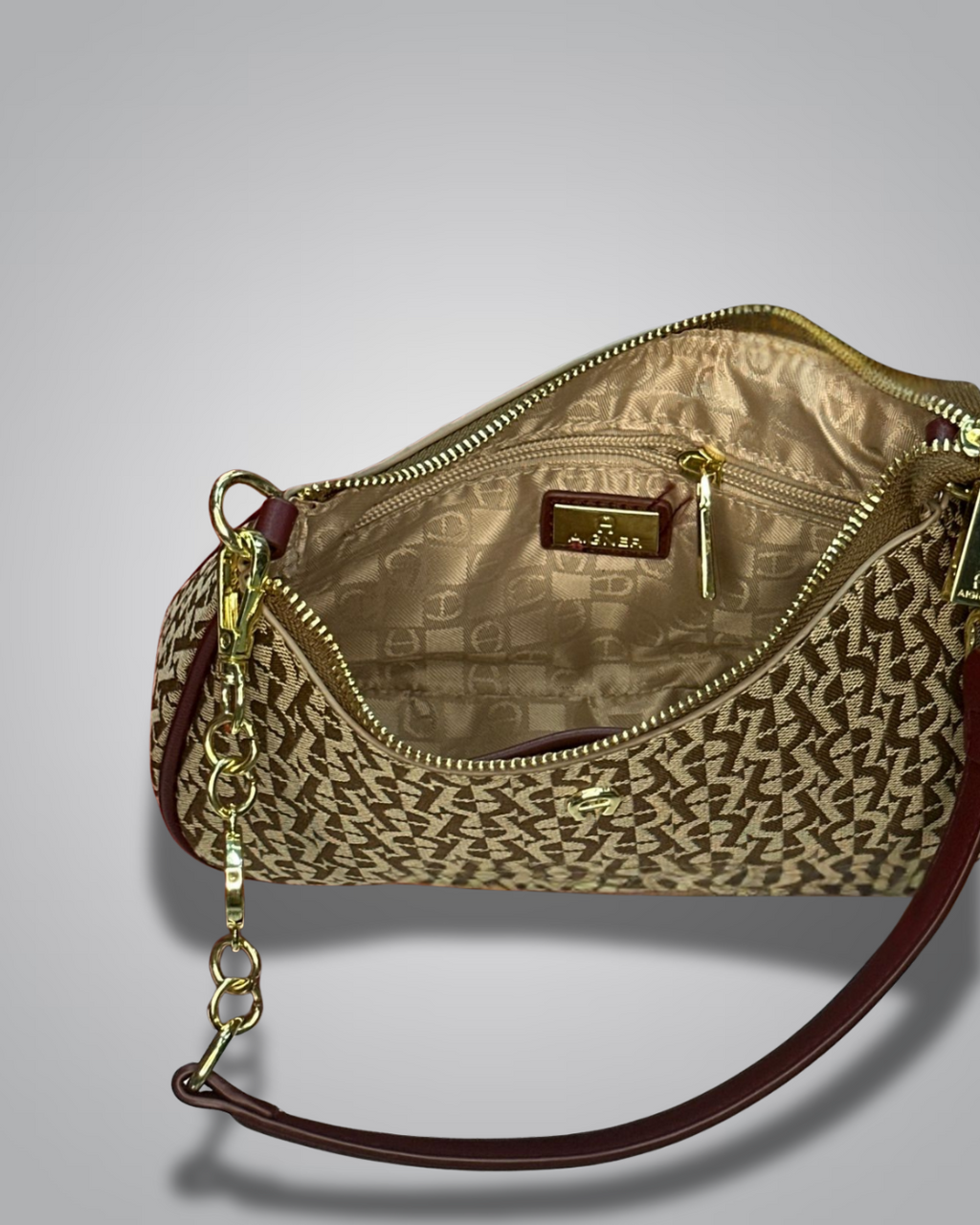 Handbag with monogram pattern on a gray background- Valentino Impex