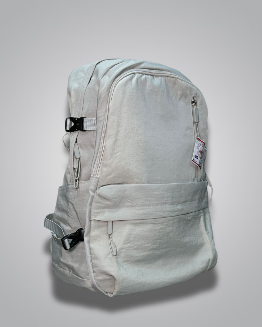 Light gray backpack with a visible brand label on a gray background- Valentino Impex