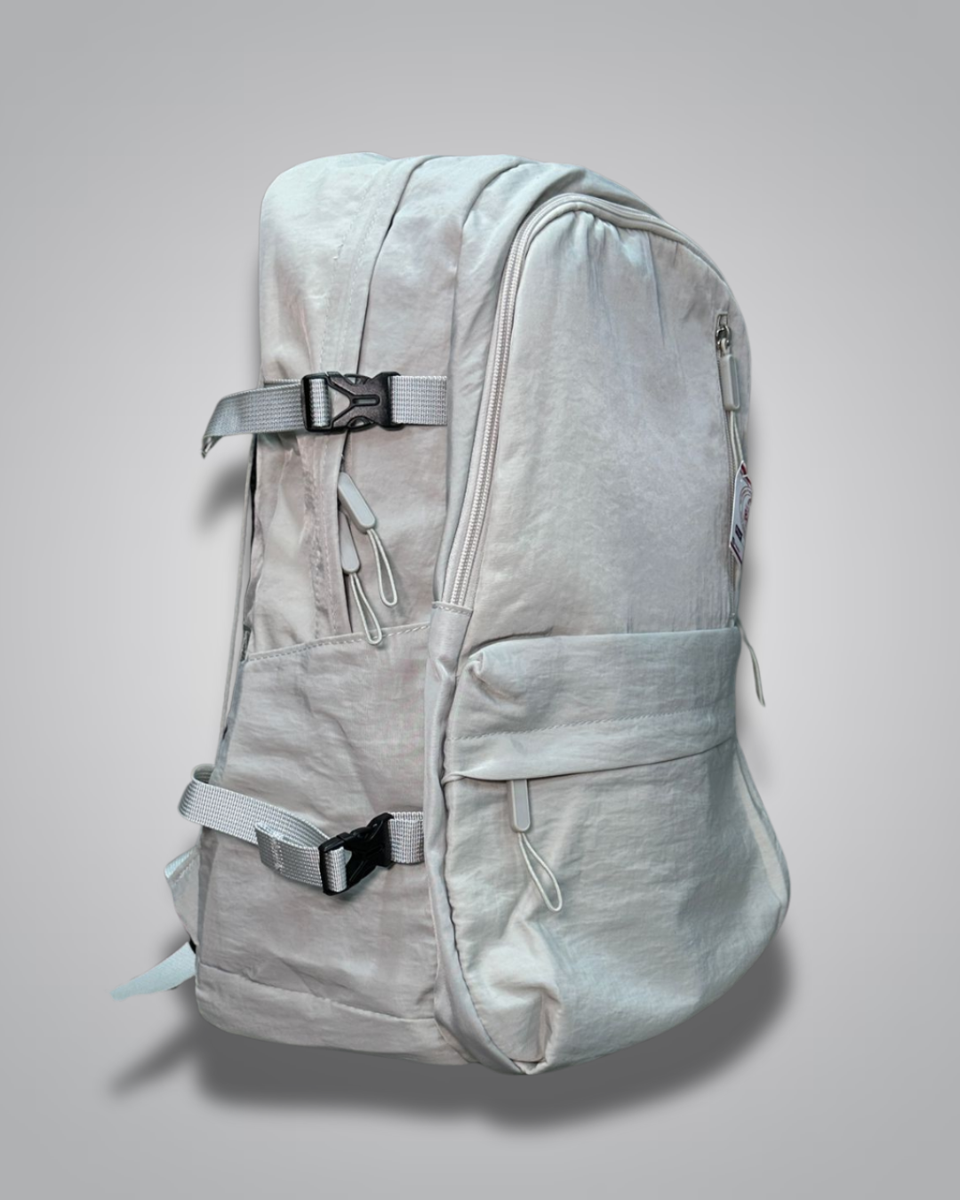 Light gray backpack with a visible brand label on a gray background- Valentino Impex