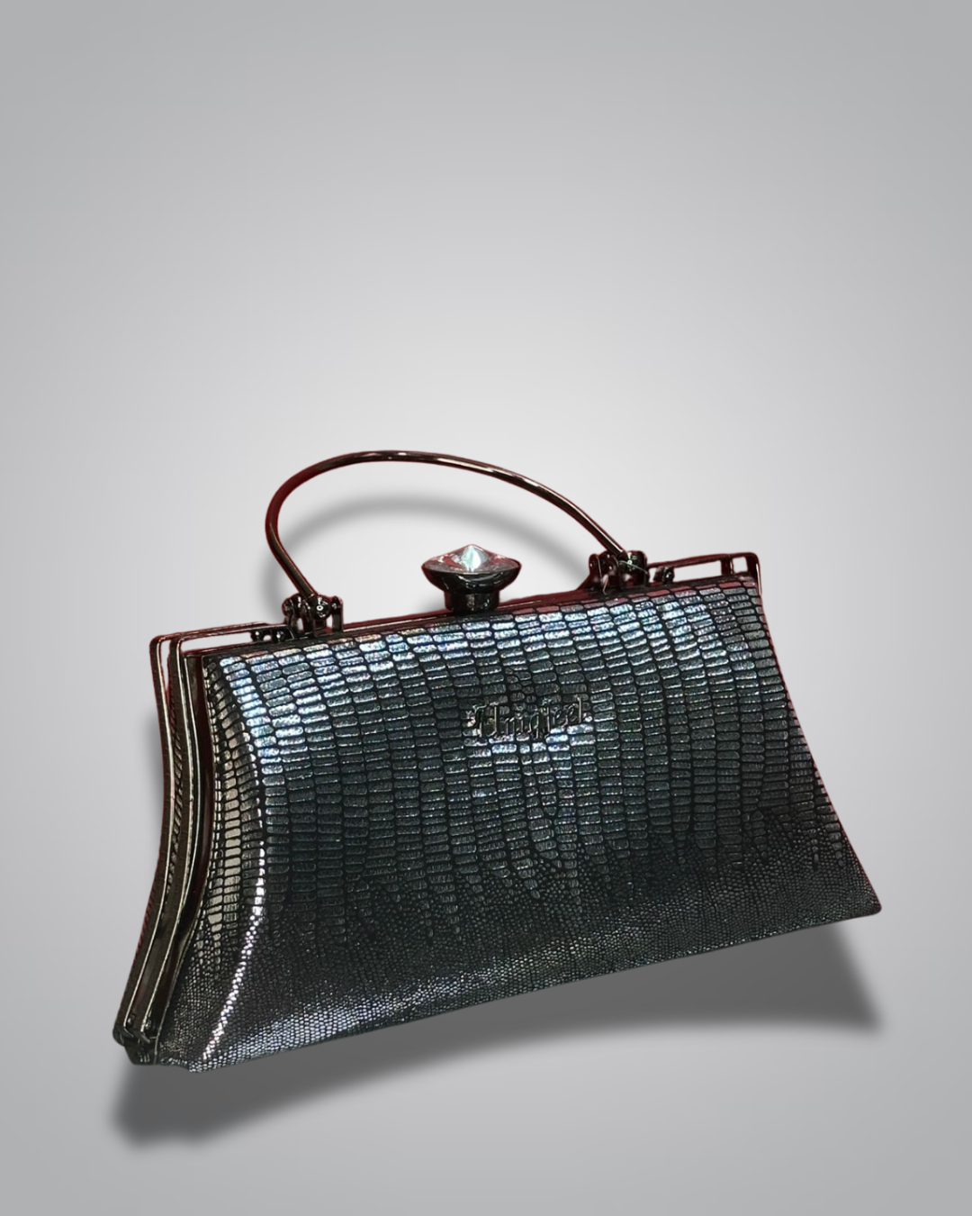 Vintage handbag with metallic sheen on a gray background- Valentino Impex
