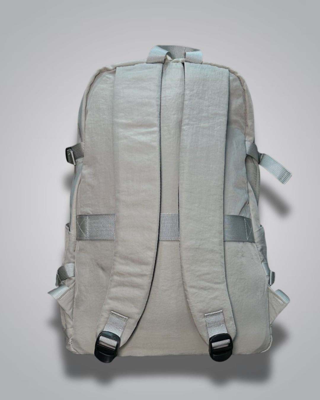 Light gray backpack with a visible brand label on a gray background- Valentino Impex