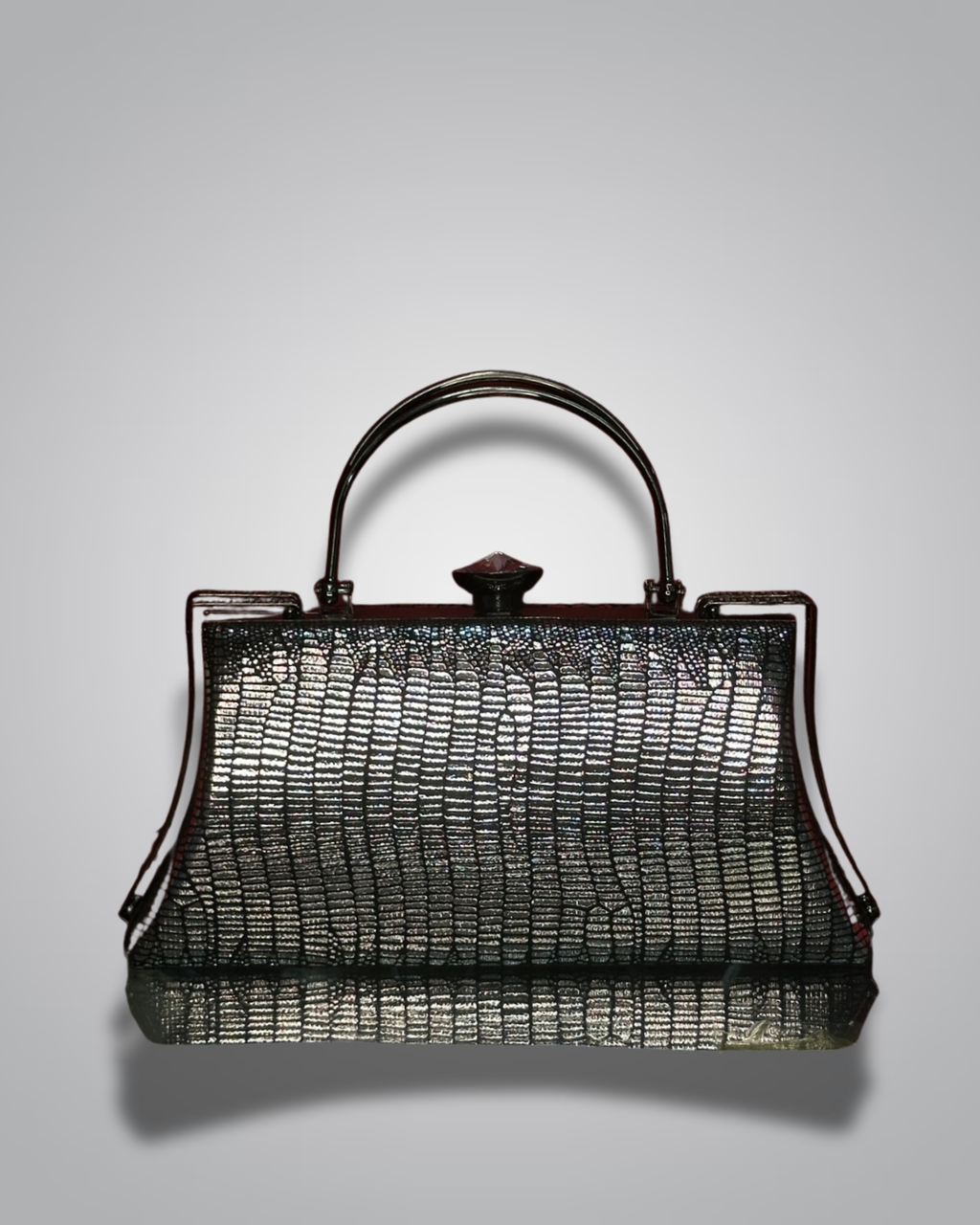 Vintage handbag with metallic sheen on a gray background- Valentino Impex