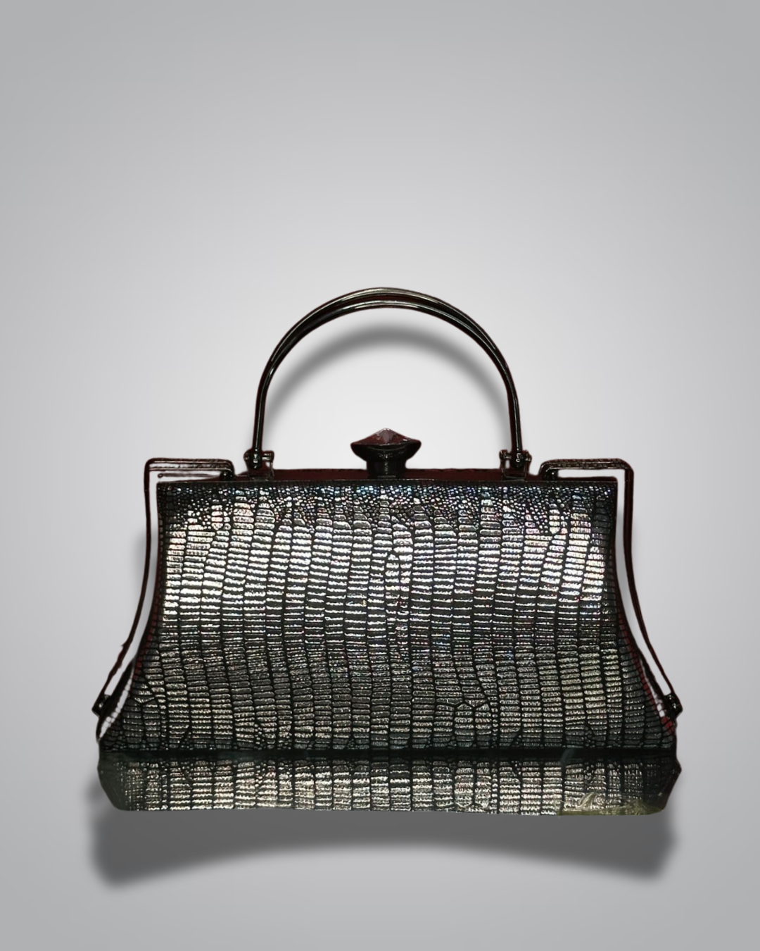 Vintage handbag with metallic sheen on a gray background- Valentino Impex