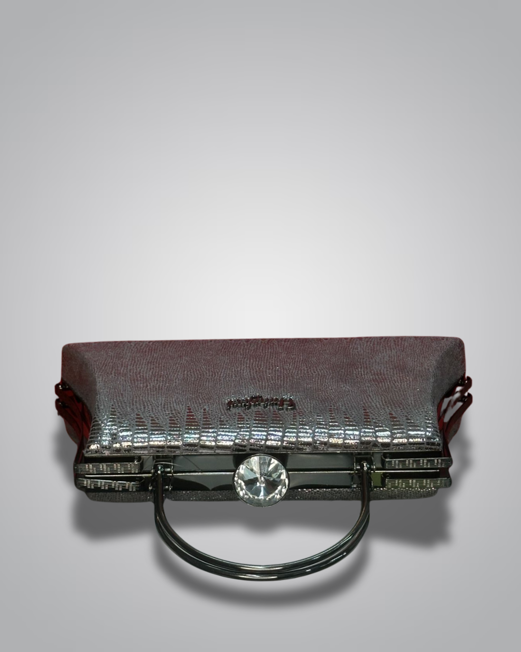 Vintage handbag with metallic sheen on a gray background- Valentino Impex