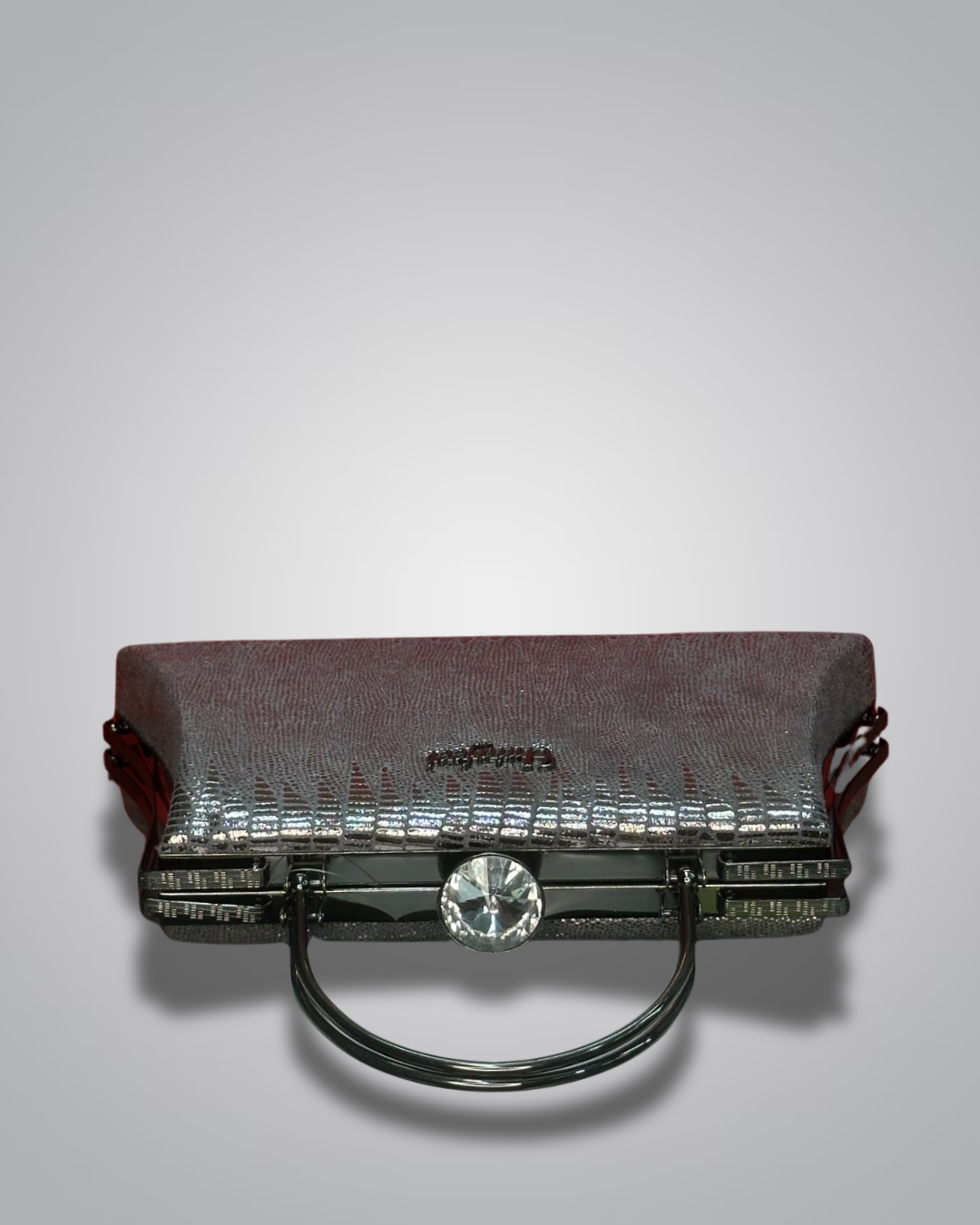 Vintage handbag with metallic sheen on a gray background- Valentino Impex