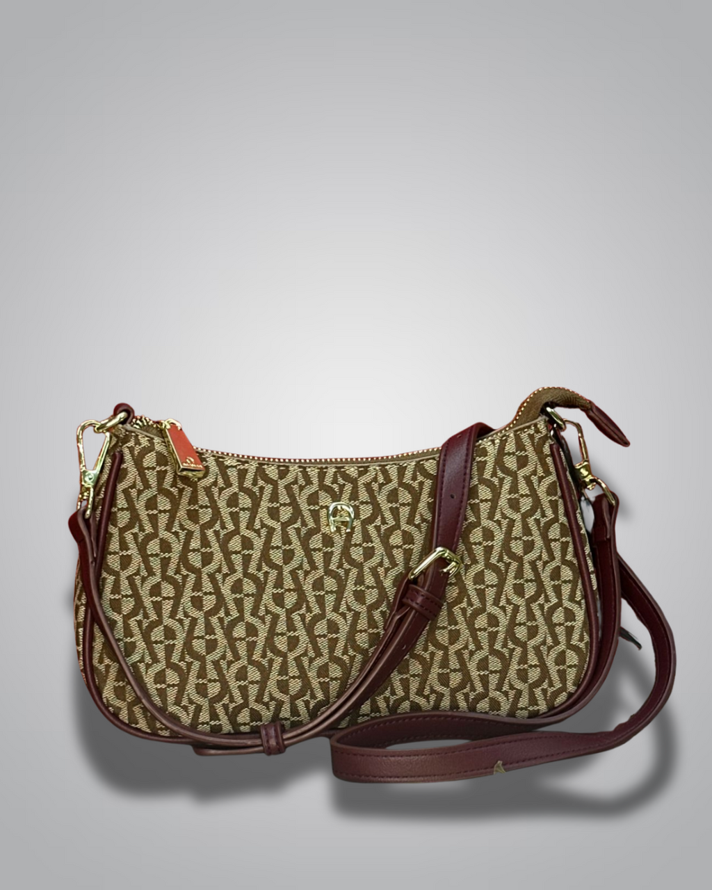 Handbag with monogram pattern on a gray background- Valentino Impex