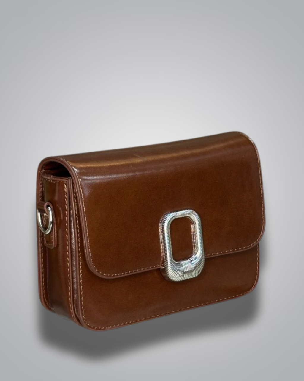 Brown leather handbag with a silver buckle on a gray background- Valentino  Impex