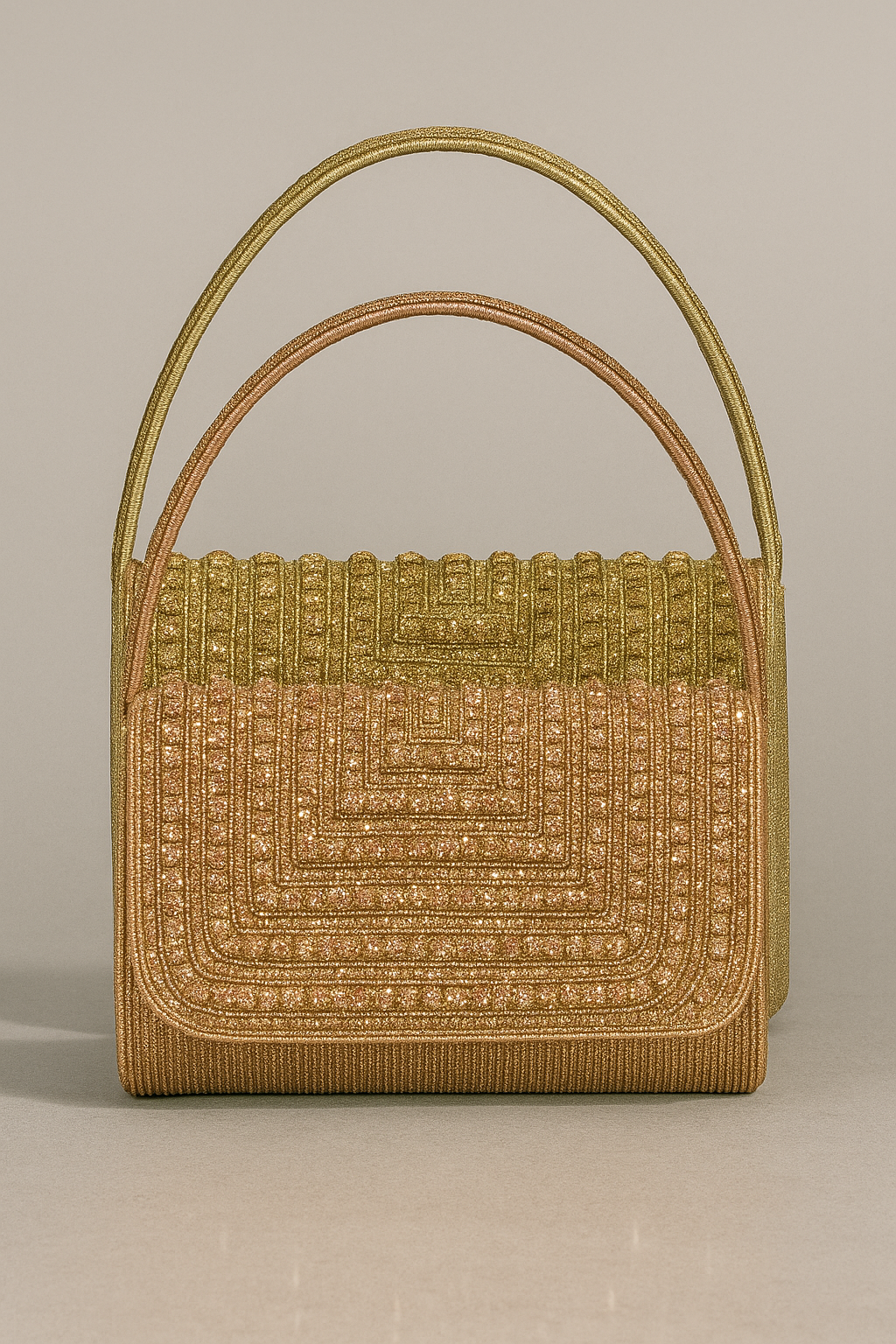 Gold handbag with intricate patterns on a beige background