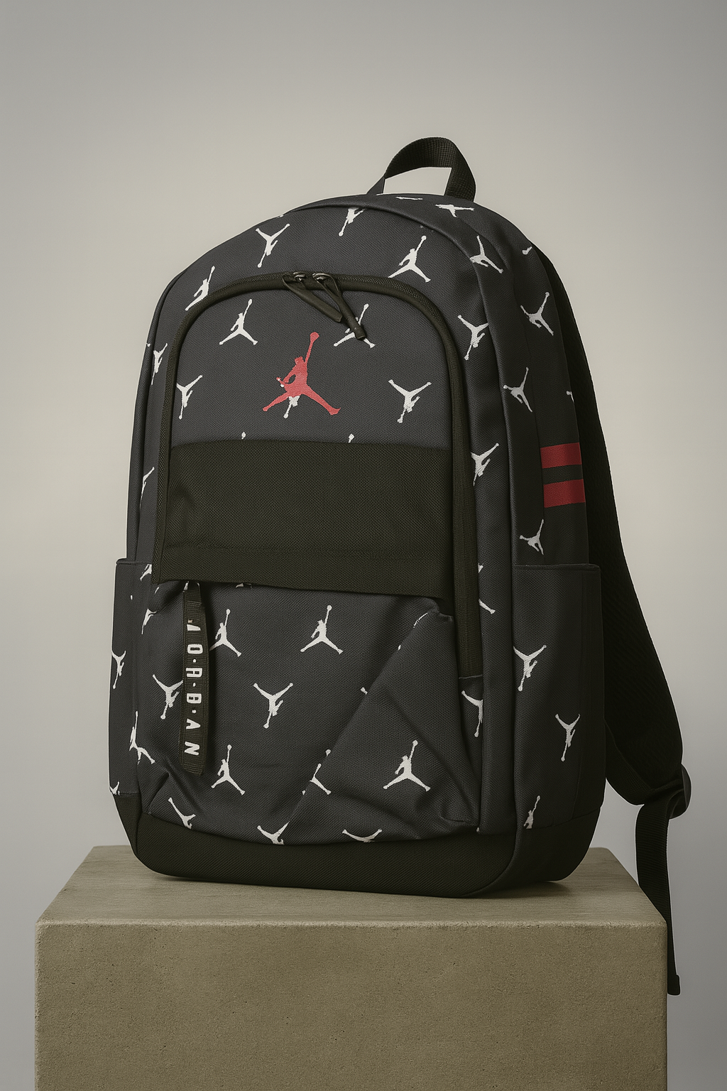 Black backpack with Jordan logo and pattern on a beige background