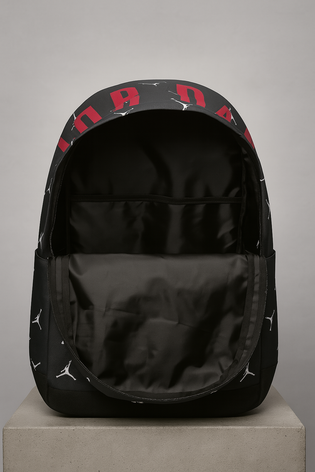 Black backpack with red and white patterns on a gray background