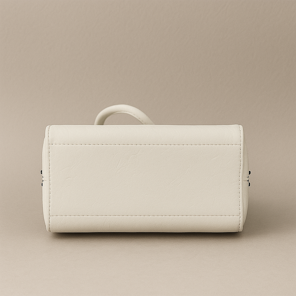 Beige leather bag on a beige background
