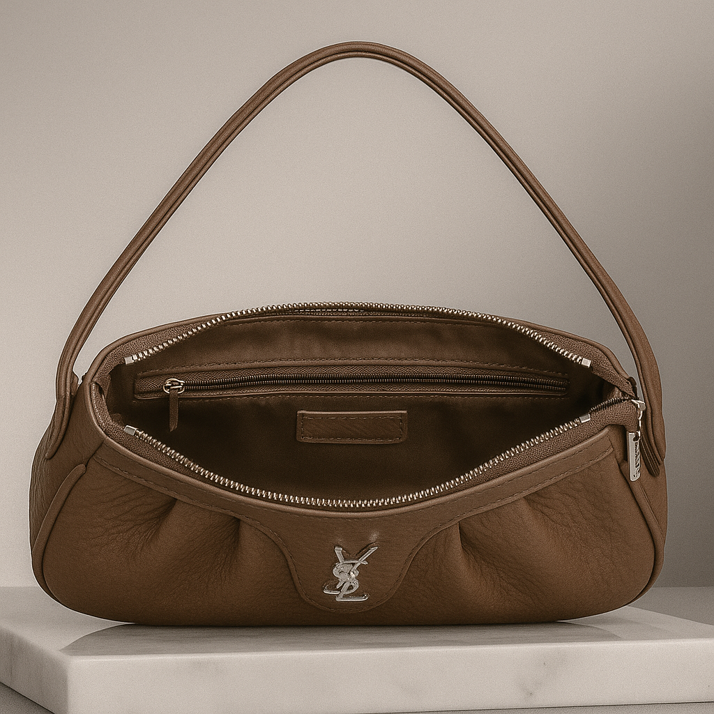 Brown handbag with a visible brand logo on a neutral background