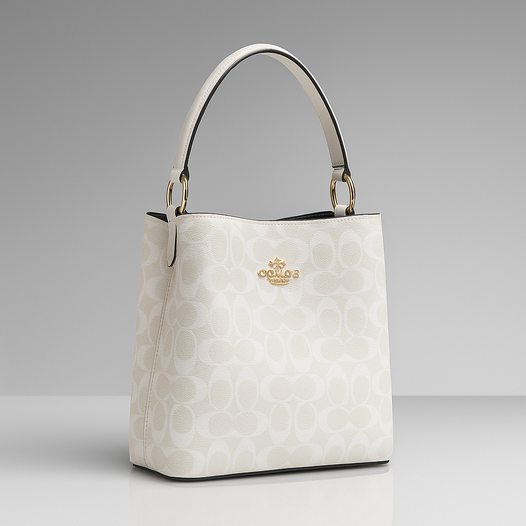 White handbag with a visible brand logo on a gray background