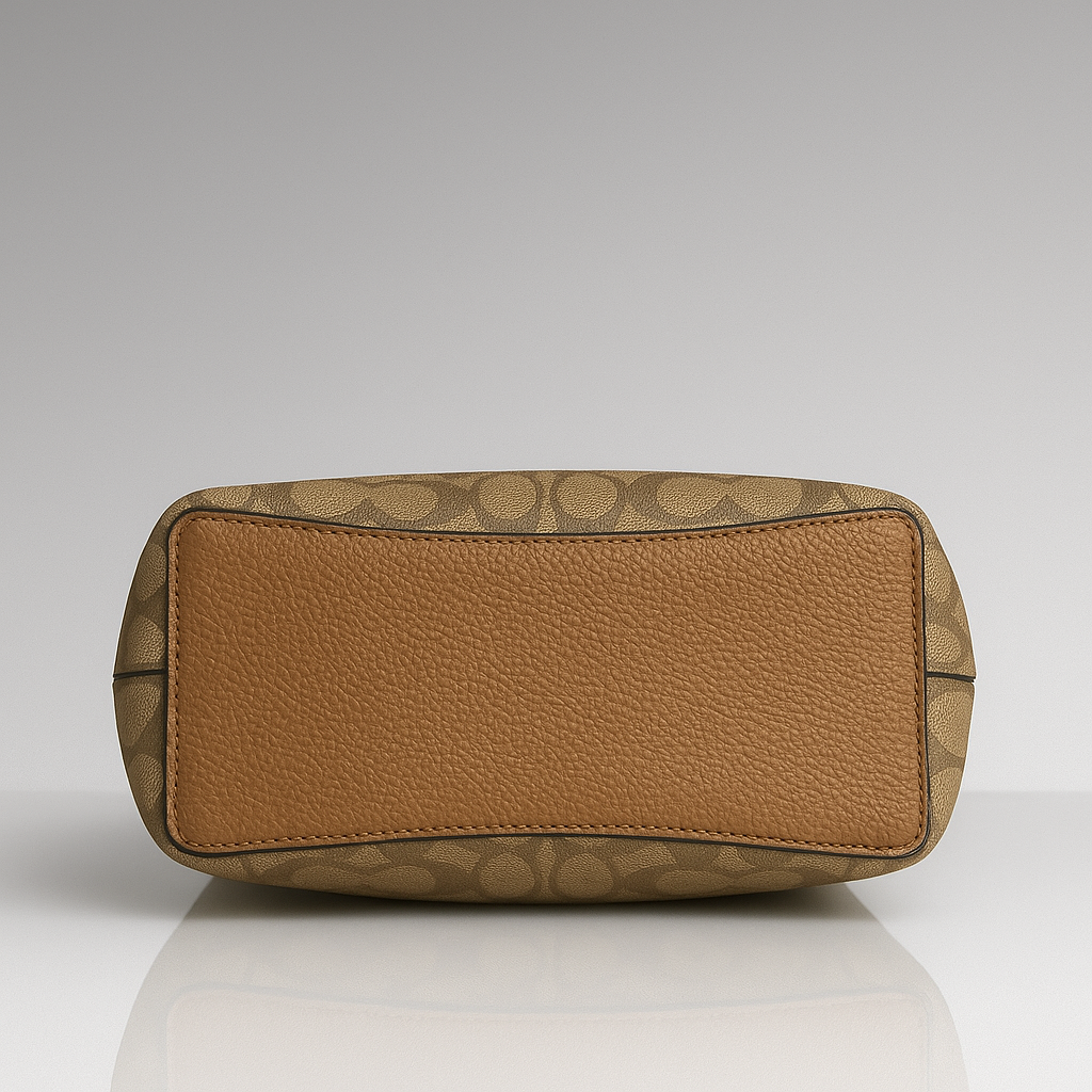 Tan handbag with pebbled texture and brand logo on a light gray background- Valentino Impex