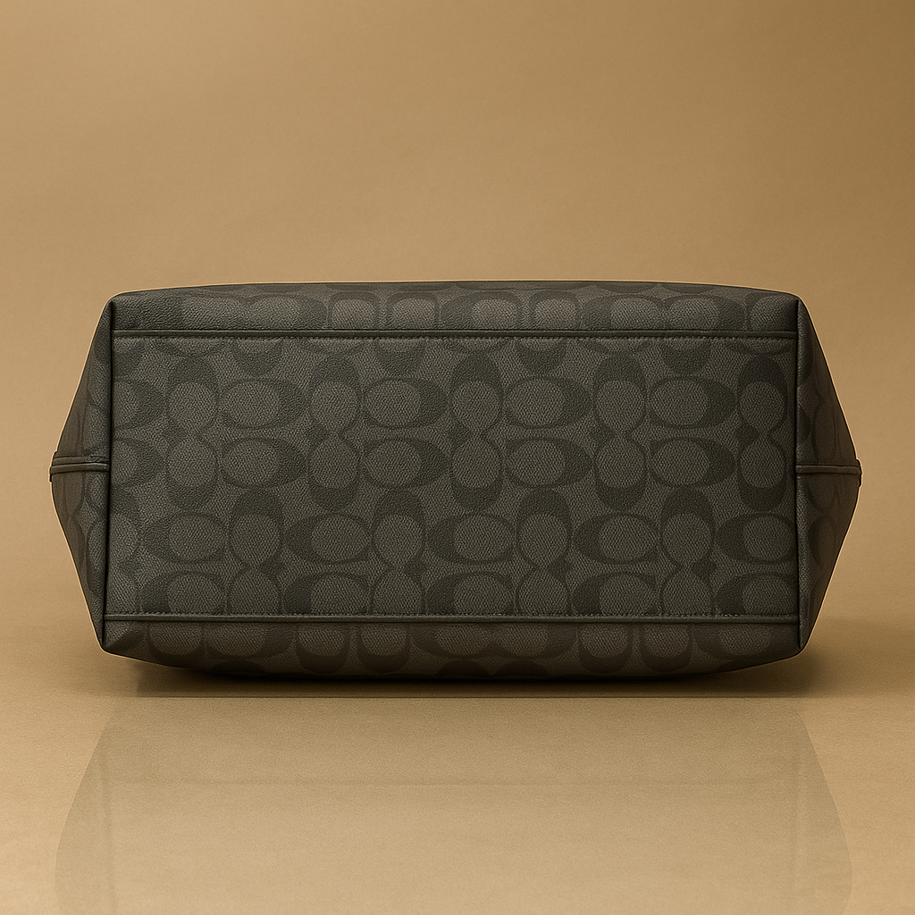 Black patterned bag on a beige background