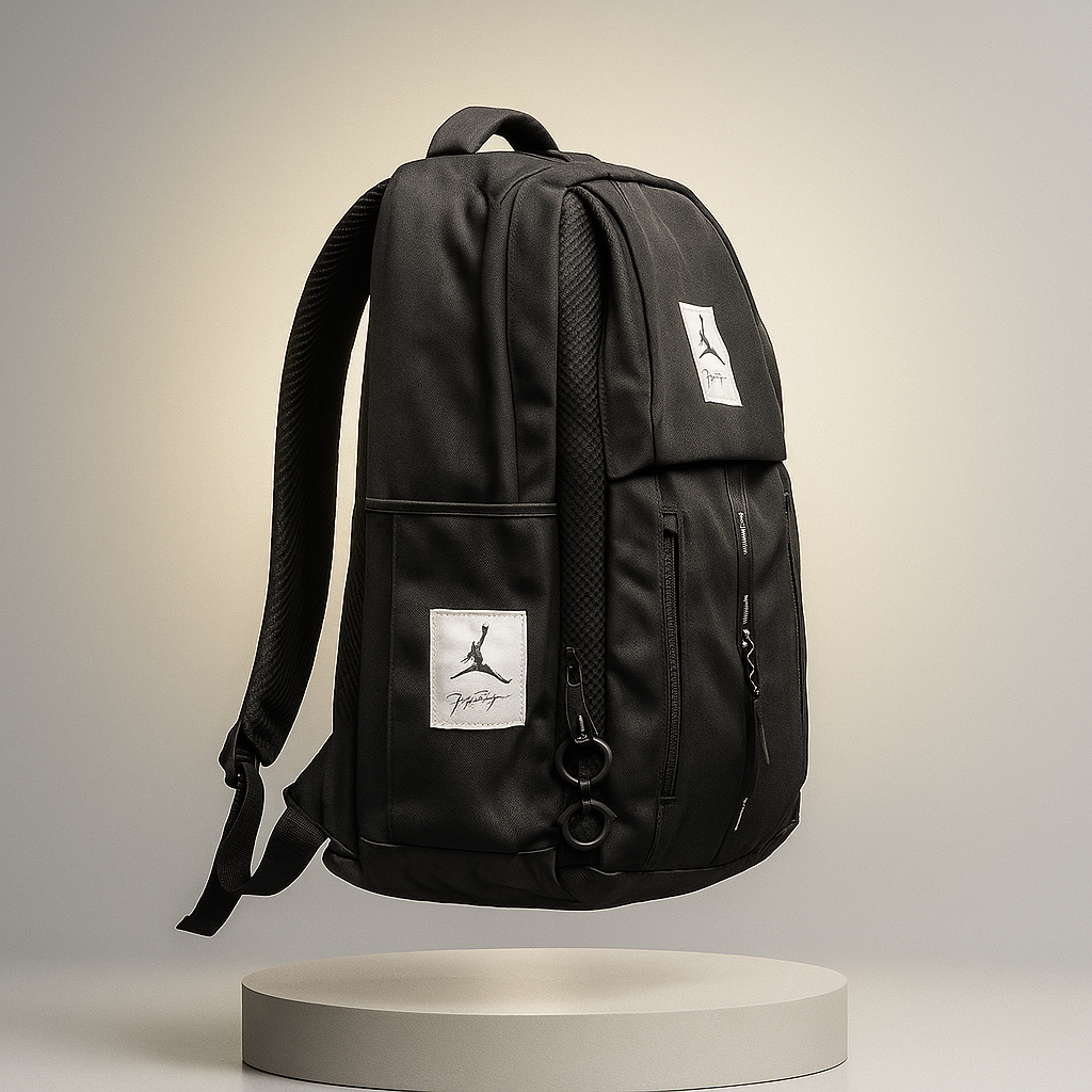 Black backpack with a brand logo on a neutral background- valentino impex